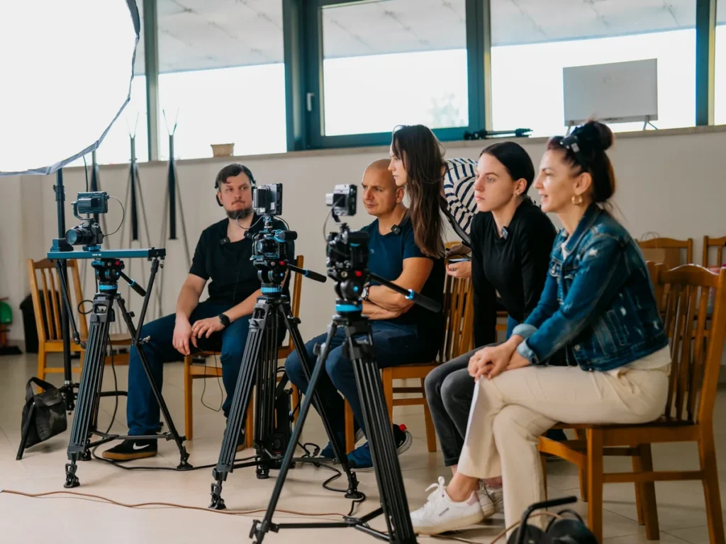 The Mačiukas Media crew and clients watching the monitors during an interview shoot