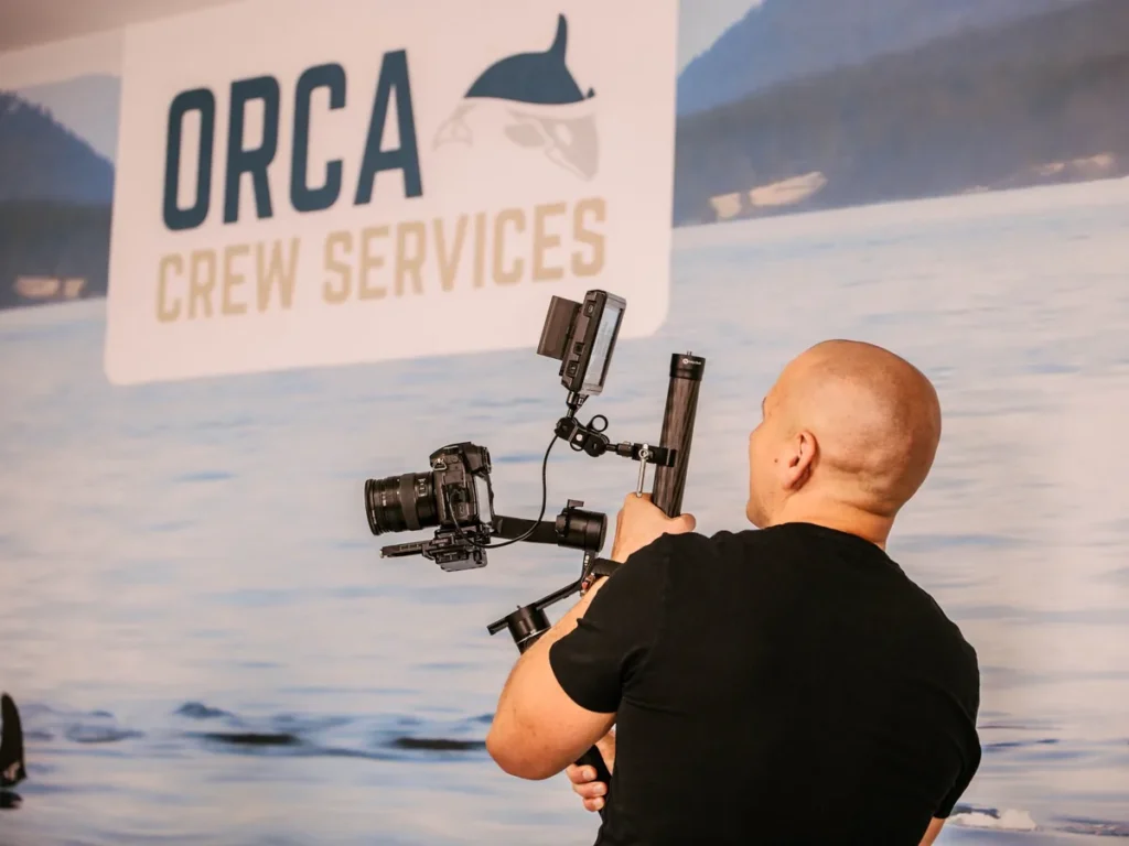 Eugenijus Mačiukas filming with a gimbal at the office of Orca Crew Services, an international company in Lithuania