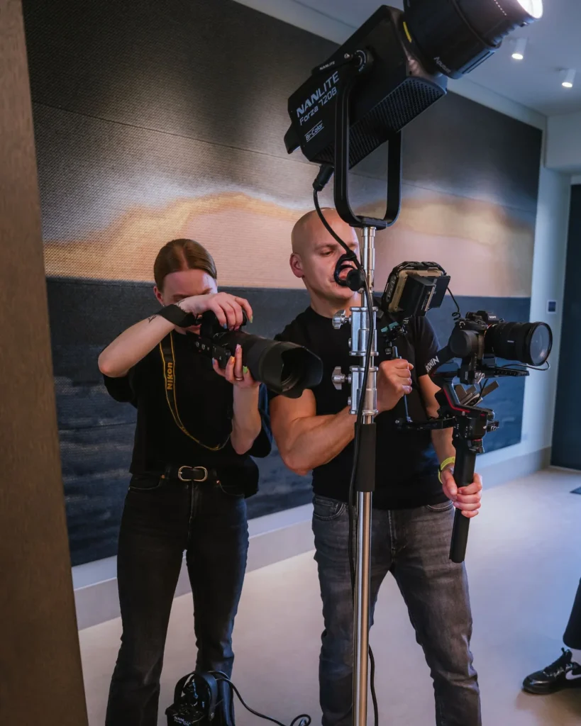 Mačiukas Media photographer and videographer shooting side by side under a Nanlite film light — photos and video on the same day